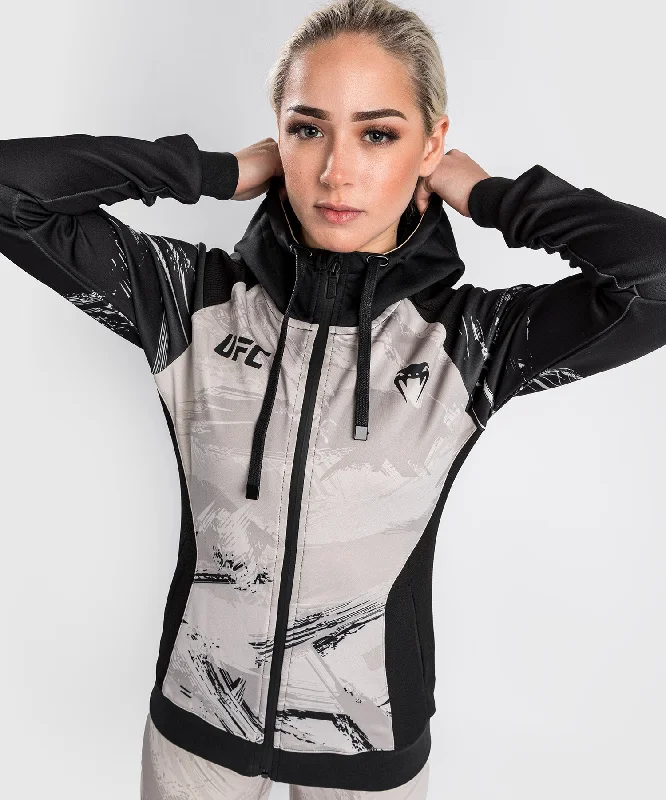 UFC Venum Authentic Fight Week 2.0 Women’s Zip Hoodie - Black/Sand Hoodie with Relaxed Fit Easy Casual UFC Venum Authentic Fight Week 2.0 Women’s Zip Hoodie - Black/Sand Hoodie with Relaxed Fit Easy Casual